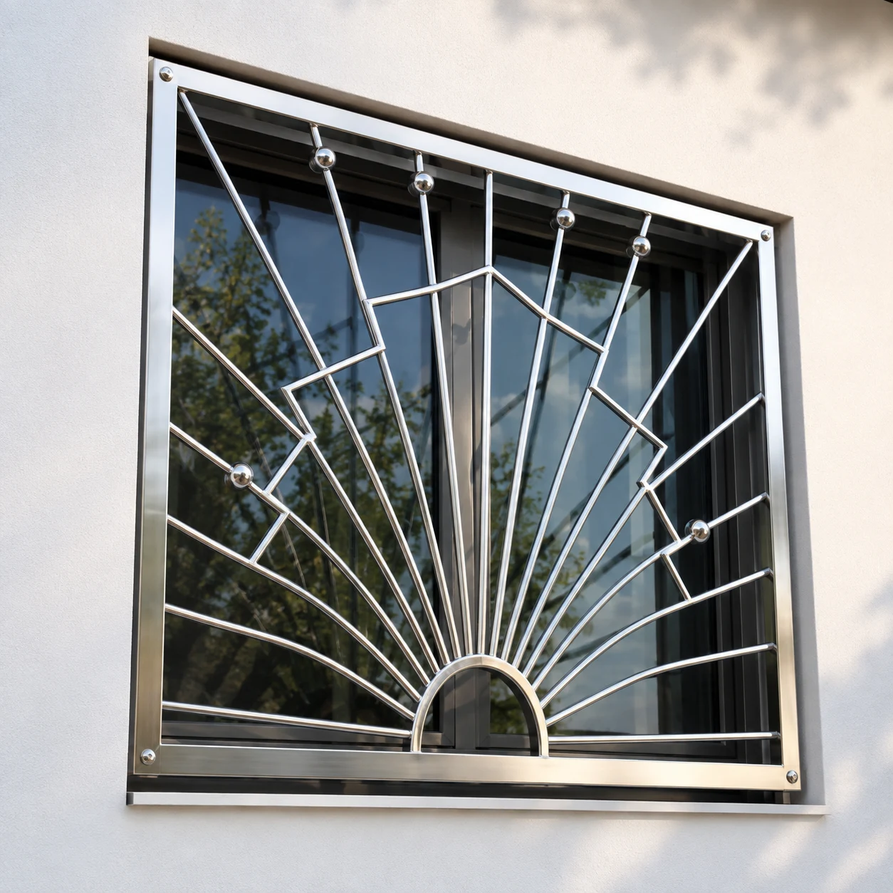 Modern Stainless Steel Sunburst Window Grill Design for an Indian home exterior